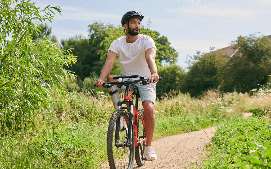 Electric vehicle charging-point and a lady next to a car