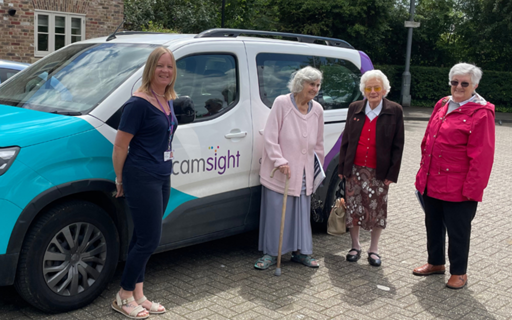 CamSight vehicle with four women in front smiling.